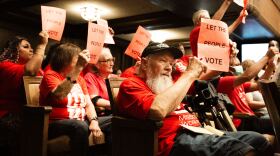 Protestors held up signs throughout the Royals ordinance during the Aug. 20, 2026, legislative session in City Hall, demanding that the people vote on issues that would affect them instead of the city council.