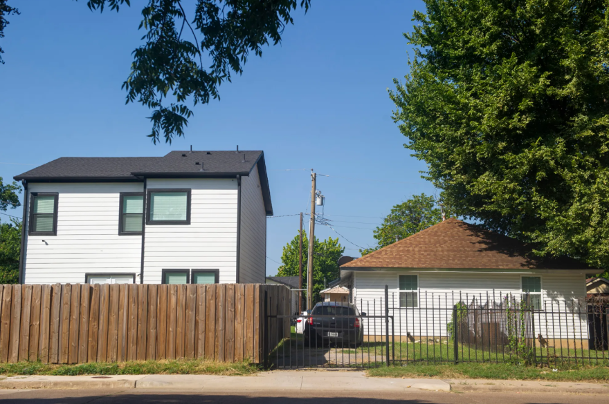 A recently built home sits next to an older home in South Dallas on July 29, 2025. The city's affordable housing stock is quickly vanishing, a new report says.