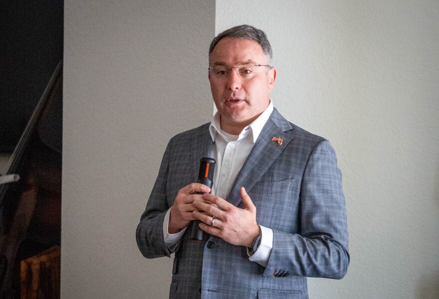 Alex Vindman, a Democratic candidate for U.S. Senate, speaks in Orlando during a private visit with donors on May 15, 2026. Vindman says he is a “big believer” in voluntary national public service programs like AmeriCorps, and suggested they could offer some relief to recent college graduates struggling to find work because of generative AI.
