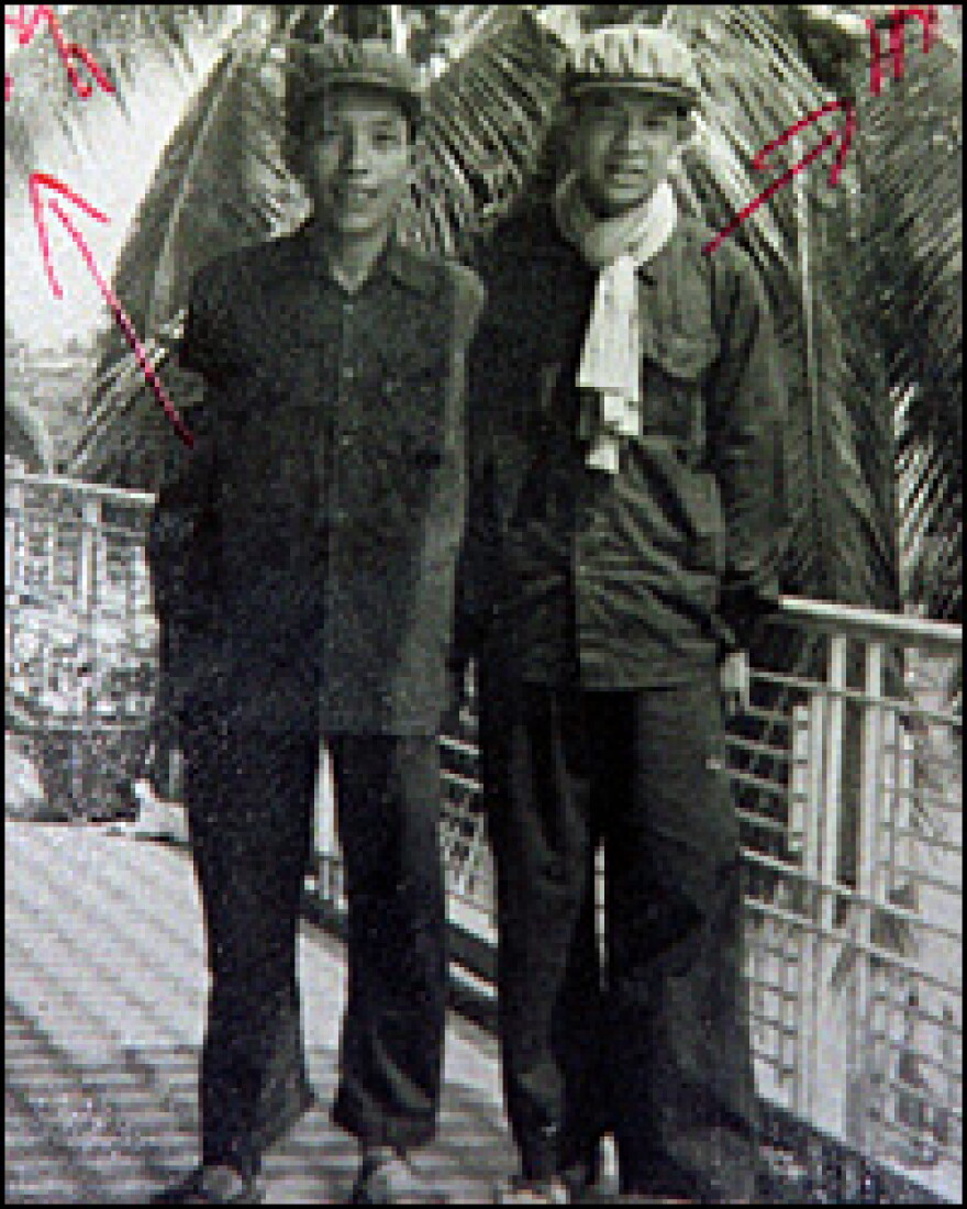 Duch, left, the fearsome chief of the Khmer Rouge's security service whose real name is Kaing Khek Iev, and his aide Sok, in a villa of the Cambodian capital Phnom Penh in 1976. Duch, who ordered the torture and killing of at least 14,000 men, women and children in the late 1970s, was indicted by Cambodia's international genocide Tribunal on Tuesday.