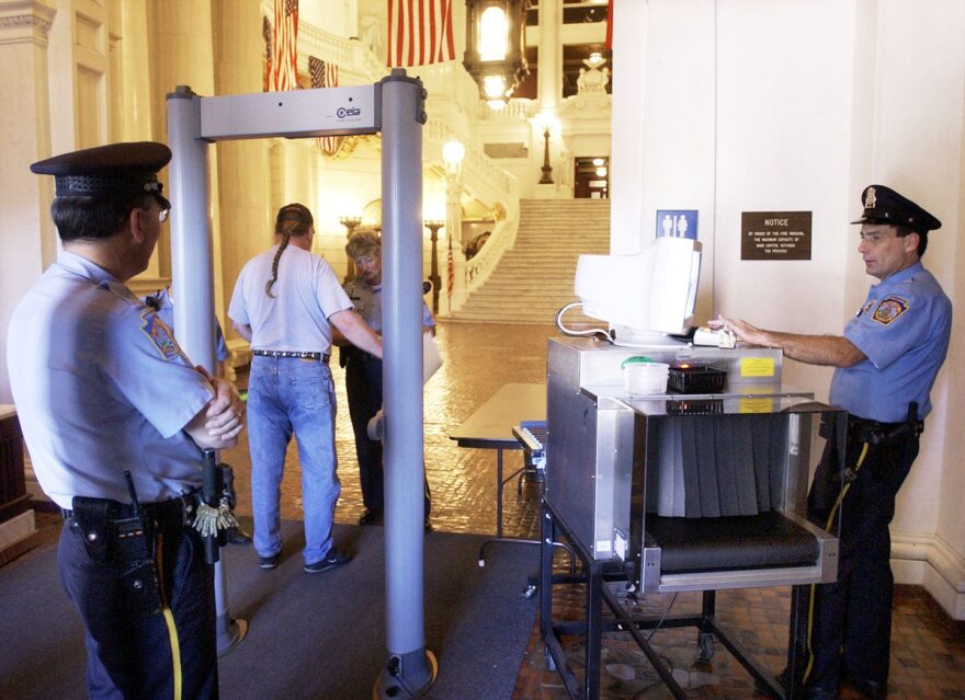 Capitol police officers stand guard at the Rotunda entrance of the main Capitol building in Harrisburg, Pa., Monday, Sept. 9, 2002.(AP Photo/Kalim A. Bhatti)