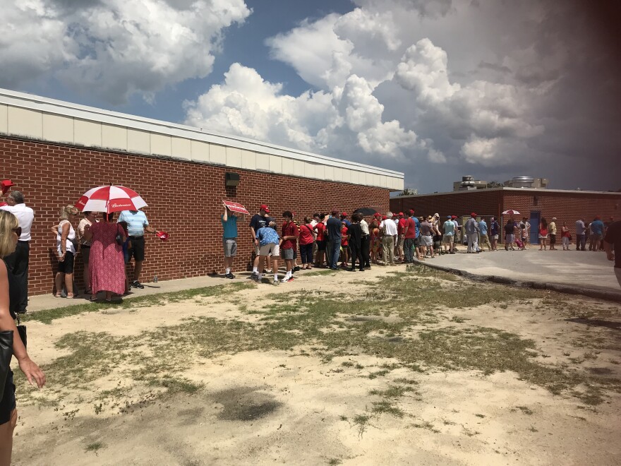 Long lines of Trump supporters braved the Summer heat to support the President and Henry McMaster.