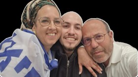 Eitan Mor, center, reunited with his parents at an Israeli Defense Forces (IDF) base on Oct. 13, 2025.
