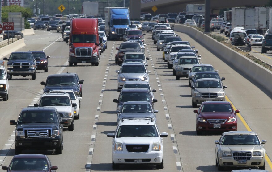Drivers work their way out of Dallas during rush hour Friday, July 1, 2016. As more travelers are driving, traffic deaths surged last year as drivers racked up more miles behind the wheel than ever before, a result of an improved economy and lower gas prices, according to preliminary government data released.