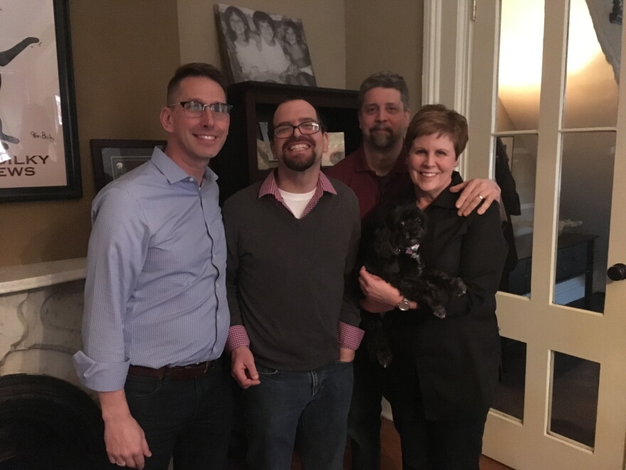 (from l to r) Caregiver Jeff, Adam Joachimiak, Adam's parents and dog pose for a picture in Adam's apartment.