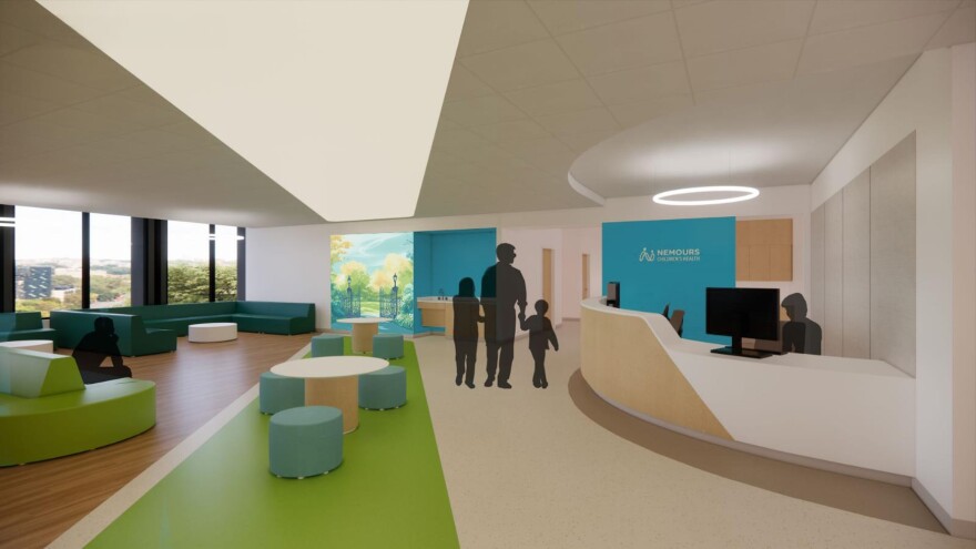 Rendering of a waiting room with green couches and a view of the estate through large windows.