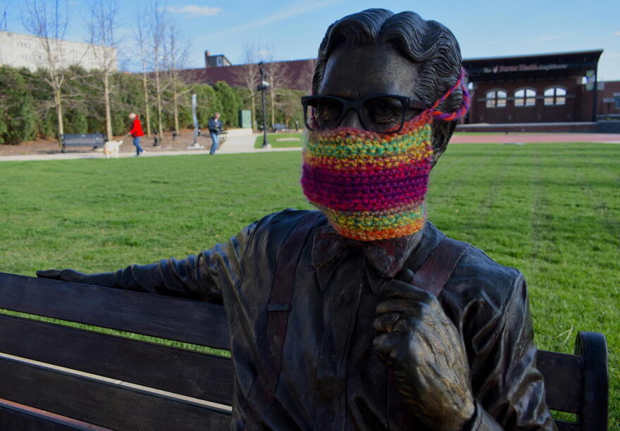 A statue of Orville Redenbacher in downtown Valparaiso with a knit mask over its face.