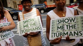 Supporters rally outside the U.S. Treasury Department in 2019 to demand that American abolitionist Harriet Tubman's image be put on the $20 bill.