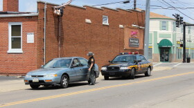A police interaction in Silverton. Hamilton County provides police in the village, but has reduced its presence at the village's town hall. 