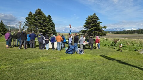 Community members gather on a field near the Bishop's Beach pavilion on Wednesday, July 1, 2026 in Homer, Alaska.