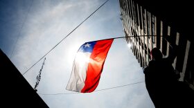 A man waves a Chilean national flag.