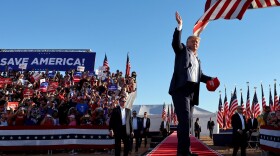 Former President Donald Trump tosses Save America hats to the crowd at a campaign rally at Legacy Sports USA on Oct. 09, 2022 in Mesa, Arizona. Trump was stumping for Arizona GOP candidates, including gubernatorial nominee Kari Lake, ahead of the midterm election on November 8.  (Mario Tama/Getty Images)