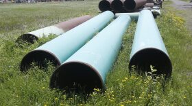 FILE - Pipeline used to carry crude oil sits at the Superior, Wis., terminal of Enbridge Energy, June 29, 2018. Attorneys for a Wisconsin Native American tribe are set to argue Thursday, May 18, 2023, that a federal judge should order an energy company to shut down an oil pipeline the tribe says is at immediate risk of being exposed by erosion and rupturing on reservation land. (AP Photo/Jim Mone, File)