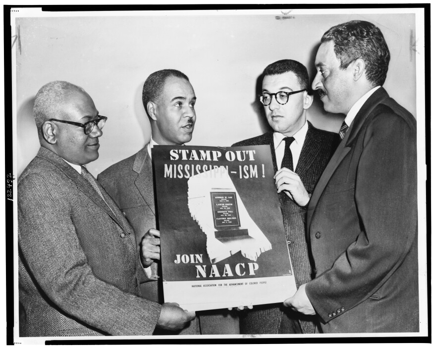 NAACP special counsel Thurgood Marshall (far right) holding a poster against racial bias in Mississippi with other NAACP leaders around 1956, from left: Henry L. Moon, director of public relations; Roy Wilkins, executive secretary; Herbert Hill, labor secretary.