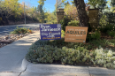 A sign endorsing Ryan Jamieson for city council is next to a sign endorsing Aquiles La Grave in Boulder’s mayoral race at the intersection of 11th Street and Baseline Road in Boulder on Oct. 21, 2026.