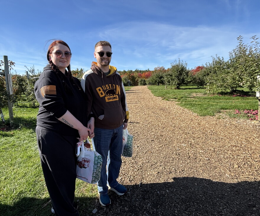 Jocelyn Litalien, of Center Barnstead, and Josh Carrier, of Concord, each filled a bag of apples at Carter Hill Orchard.