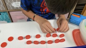A boy in foster care plays a game while waiting for placement with a foster family (Courtesy of Cindy Floyd).