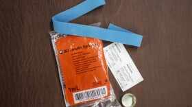 FILE - Syringes, alcohol swabs, and other supplies sit on a table in Western Pennsylvania.