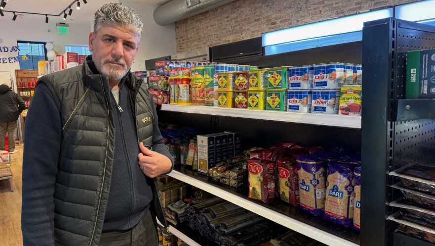Yousef Irziqat is the owner of Hebron Market in Mission Hill. He says of his workers, "they are like a family to me, so I just cannot let them go."