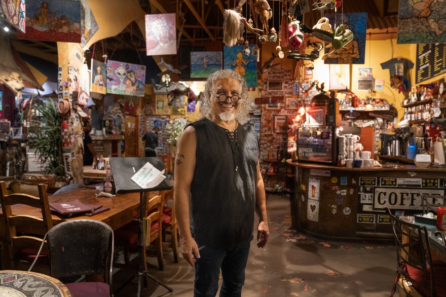 Farzad Azad, the owner of Java Jazz, often plays flamenco guitar during the cafe's music sessions.