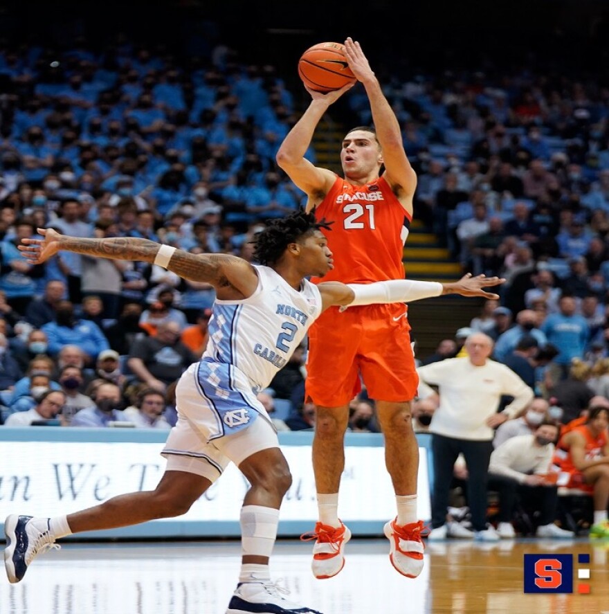 Forward Cole Swider (Orange) shooting a jumper over North Carolina’s Caleb Love (White). The Villanova transfer had a career high 36 points versus North Carolina.