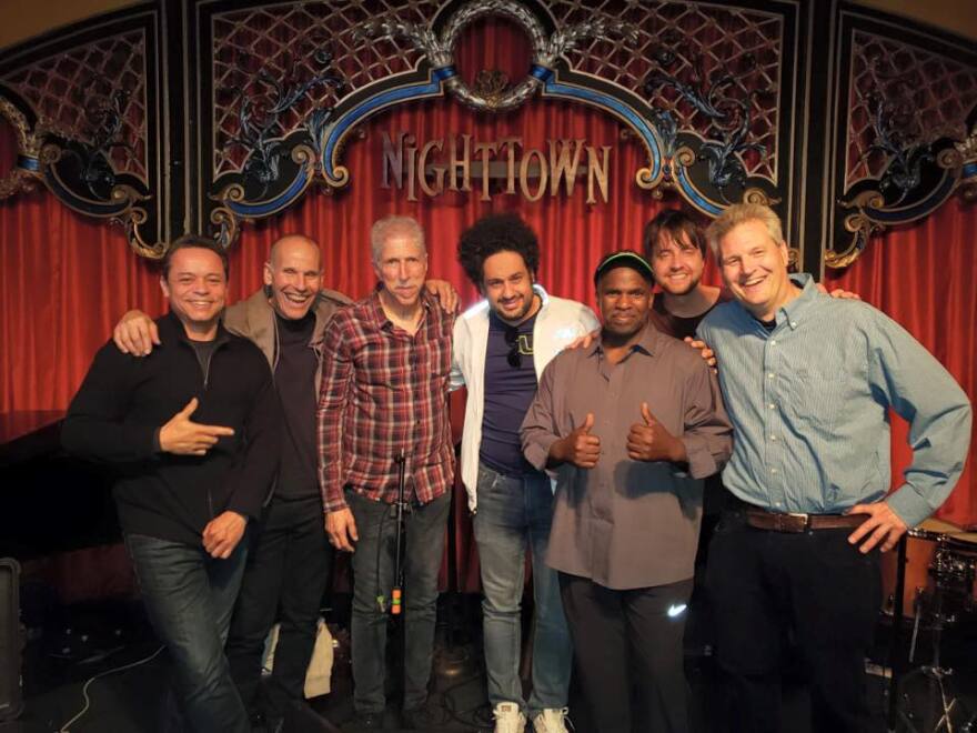 Live music promoter and producer Jim Wadsworth (far right) with members of The Yellow Jackets, Moises Borges (far left) and Diego Figueiredo (center) 