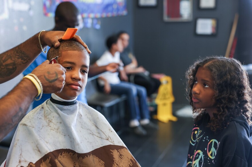 Photograph of a child getting their haircut 