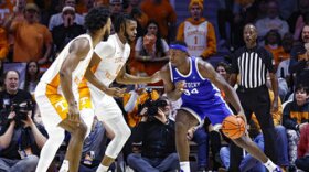 Kentucky forward Oscar Tshiebwe (34) looks for an opening as Tennessee forward Jonas Aidoo (0) and guard Josiah-Jordan James (30) defend during the first half of an NCAA college basketball game Saturday, Jan. 14, 2023, in Knoxville, Tenn. (AP Photo/Wade Payne)