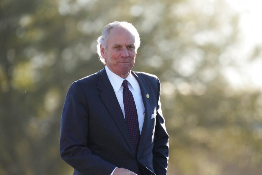 FILE - South Carolina Gov. Henry McMaster prepares to address a crowd awaiting former President Donald Trump on Saturday, March 12, 2022, in Florence, S.C. The candidate field is set for South Carolina's 2022 elections, which feature a competitive Democratic gubernatorial primary, wide-open education superintendent race and a pair of intraparty congressional battles featuring Republican incumbents fending off challengers backed by former President Donald Trump. (AP Photo/Meg Kinnard, File)