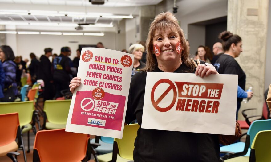  One of the many union members who came to the public meeting in Denver on November 1 to voice their opposition to the proposed grocery store merger.