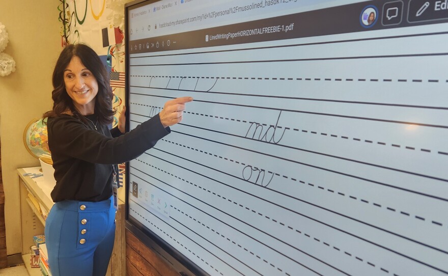 Diane Mussoline teaches cursive handwriting to her second-grade students at Valley Elementary/Middle School.
