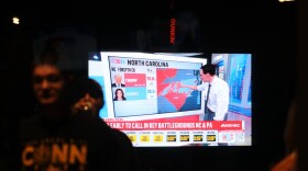 MSNBC plays at an election night party in Hartford, Connecticut in 2024. On the screen, Steve Kornacki breaks down vote totals in the swing state of North Carolina.
