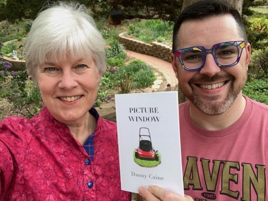 Kaye McIntyre, Danny Caine holding Picture Window book