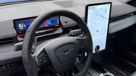 A view of the steering column with the Alcohol Detection System for Safety breath sensor technology. An LED light bar flashes red or green indicating if a driver is impaired or not and can prevent drunk driving.