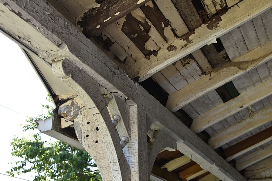  Lead paint applied to a porch, cracking and flaking off.