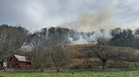 Smoke rises from a wildfire off Lower Brush Creek Road in Fairview on Thursday afternoon. Fire crews are working in steep terrain and storm blowdown fueled by Hurricane Helene’s winds. Officials are asking drivers to avoid the area so emergency vehicles can get through.