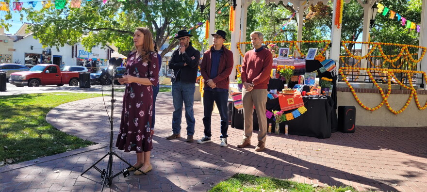 (From left to right) Rep. Melanie Stansbury, New Mexico House Speaker Javier Martínez, Albuquerque City Councilor Joaquin Baca, and Albuquerque Mayor Tim Keller stand in front of an ofrenda set up for the late activist Dolores Huerta in Old Town Albuquerque on Wednesday.
