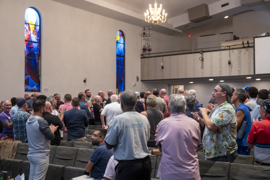 Members of the Gay Men's Chorus of South Florida applaud outgoing director Mark Kent at the group's first weekly rehearsal of the upcoming season, Tuesday, Sept. 15, 2026, at the Sunshine Cathedral in Fort Lauderdale, Fla.