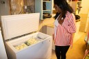 Chika Igbokwe-Yates, who donates breast milk to the Oklahoma Mothers' Milk Bank, admires her freezer stash.