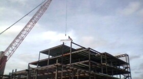 Final steel beam added to ECMC building