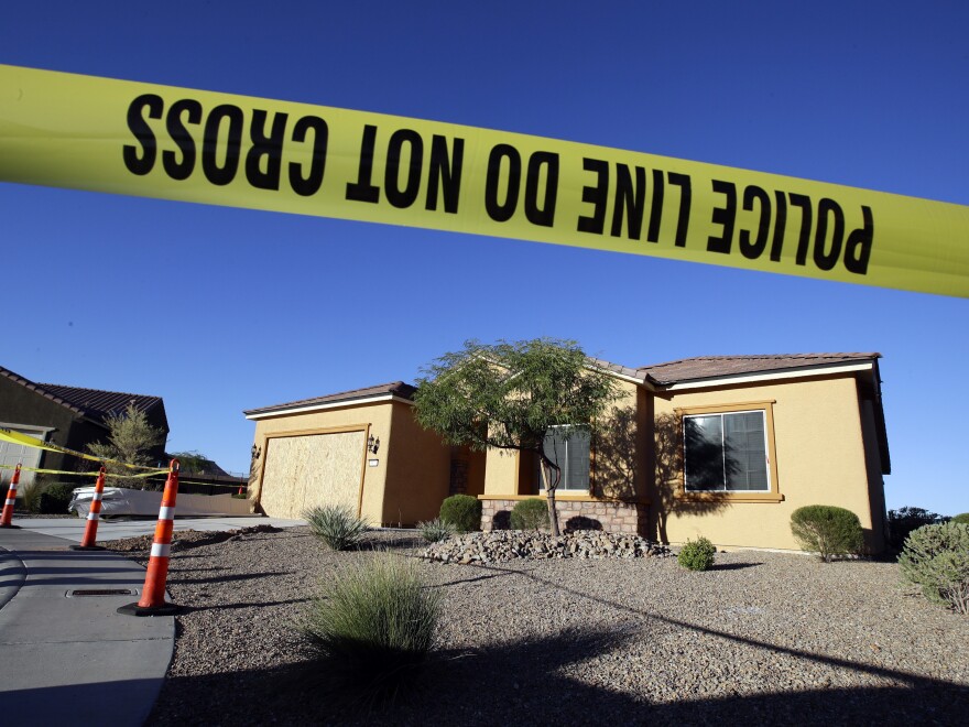 Police tape blocks off the shooter's home in Mesquite, Nev., on Monday.