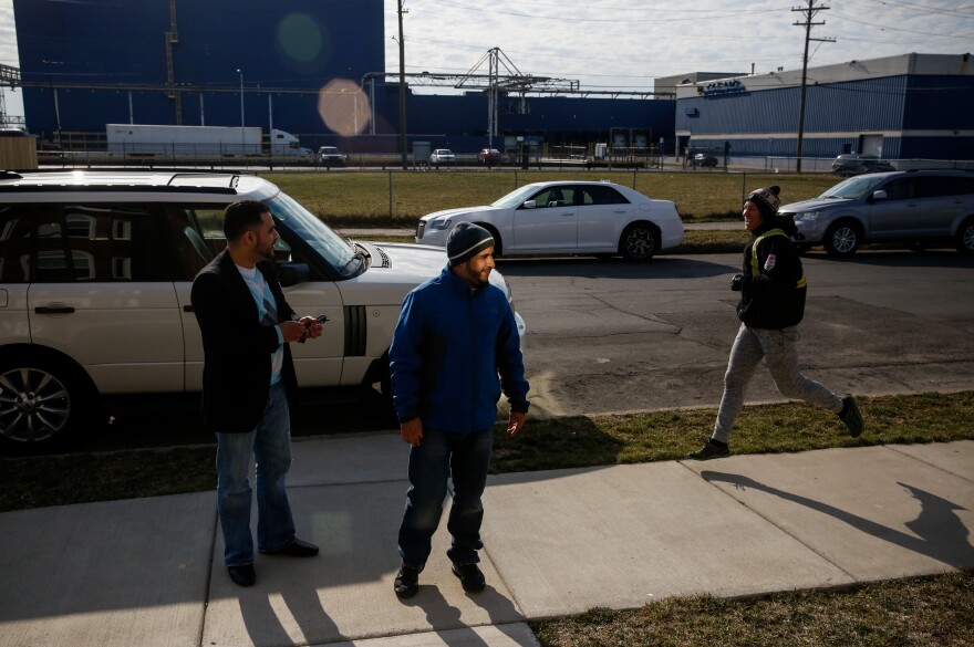 Nabil Nagi and Yunus Wasel outside the Hadwans' home in Hamtramck, Mich.