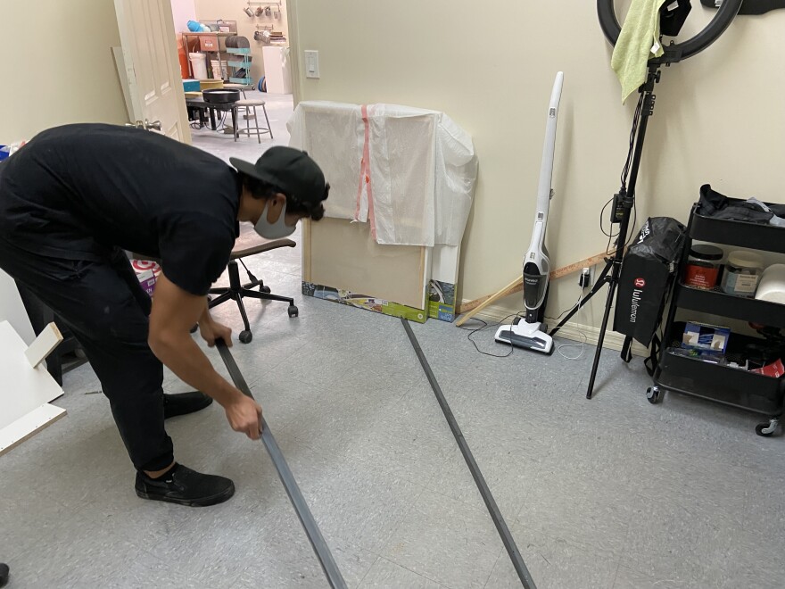 Rayka Vallias starts to shape a mold for what will be a concrete dining room table, in his studio inside the Gasper Arts Center.