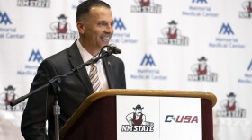 Newly appointed New Mexico State NCAA college basketball coach Jason Hooten speaks during his introduction event in Las Cruces, N.M., Sunday, March 26, 2023. (AP Photo/Andres Leighton)