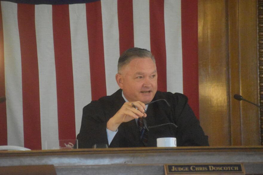 Tazewell County Circuit Judge Chris Doscotch talks to the parties involved in the media's motion to intervene in the civil cases involving Reditus Labs CEO Aaron Rossi.