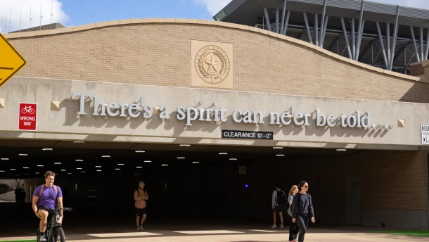 Students walk through a tunnel under Wellborn Road on the Texas A&M University campus in College Station on Nov. 13, 2025.