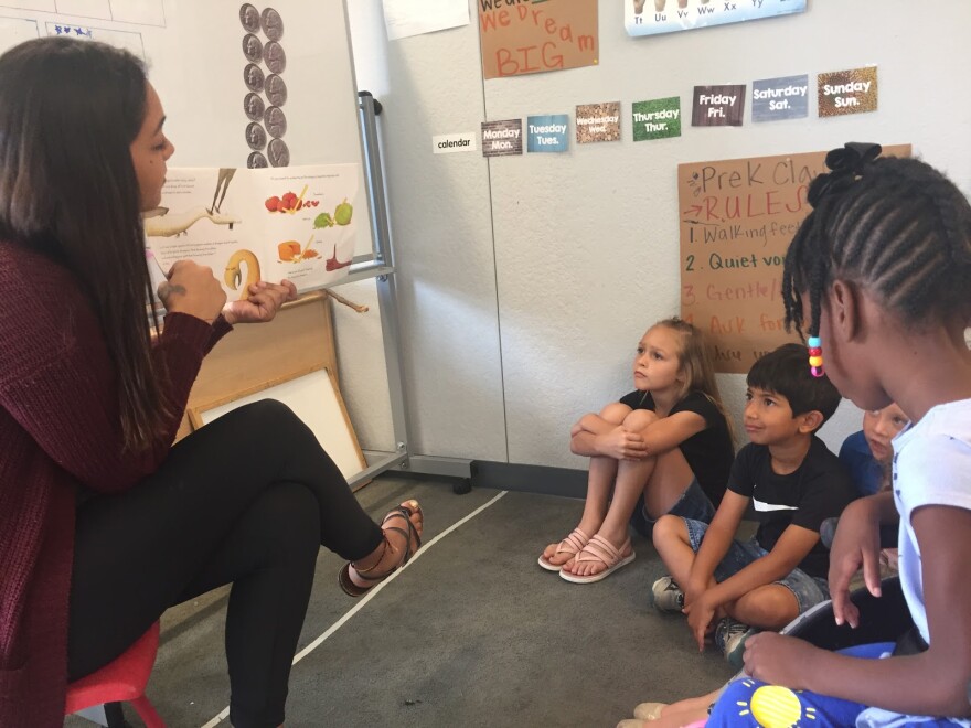 Heather Canales reads to children in a pre-kindergarten class at WovenLife, which offers early childhood development in Oklahoma City. Photo taken on August 1, 2019.