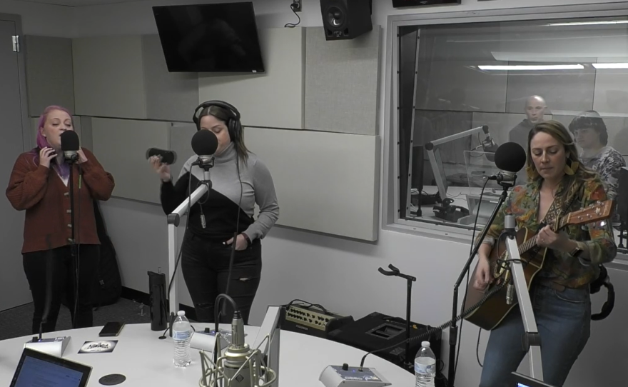 The original trio of band Eavesdrop performing for Live Music Friday.
