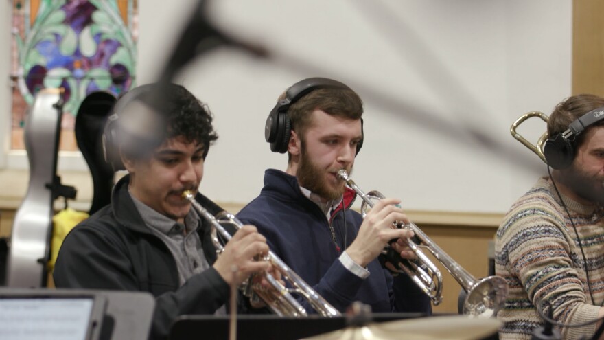 Kaboom Collective Principal Trumpet Christopher Hunt (center) rehearses with the studio orchestra.