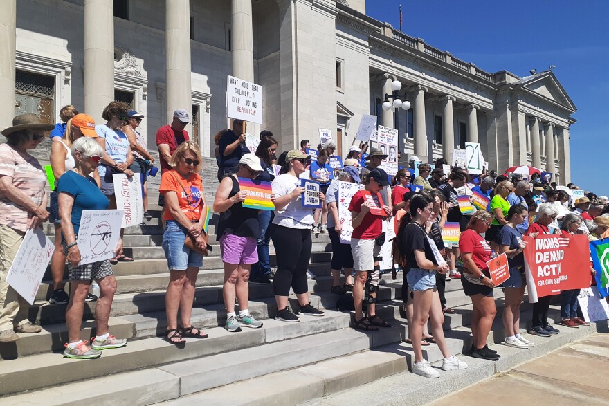 Participants in Saturday's march at the Arkansas State Capitol take part in a moment of silence.